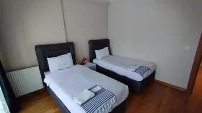two beds in a small room with at Luxury Residence in Taksim in Istanbul