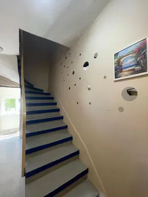 a staircase in a house with blue and white stairs at Rota Star Hotel Beyoğlu in Istanbul
