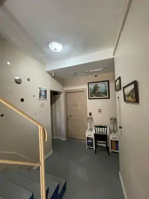 an empty room with a staircase and a door at Rota Star Hotel Beyoğlu in Istanbul