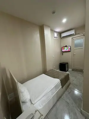 a bedroom with a bed and a television in it at Rota Star Hotel Beyoğlu in Istanbul