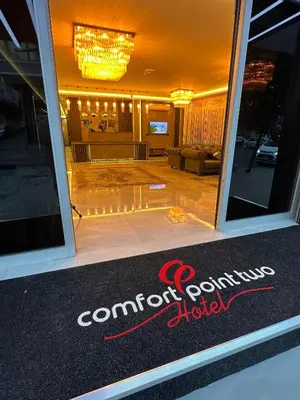 a window of a store with a sign on it at Comfort Point Two Hotel in Istanbul