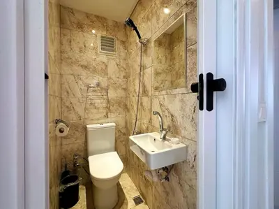 a bathroom with a toilet and a sink at Triplex in Taksim Square with 4 Bedroom in Istanbul