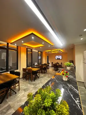 a dining room with tables and chairs and tablesktop at New Fors Hotel in Istanbul