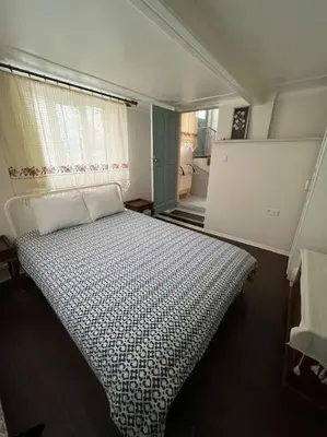a bedroom with a large bed in a room at Konak Maksem in Bursa