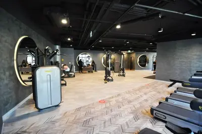 a gym with exercise equipment in the middle of a room at Modern Luxury apt at Sinpas Queen in Istanbul