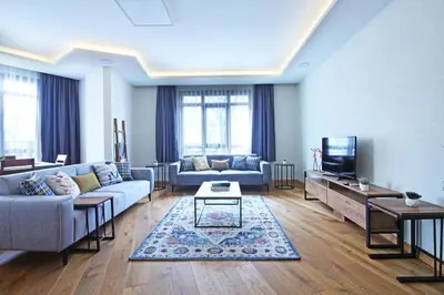 a living room with a couch and a tv at Excellent Apartments Fatih Serenity in Istanbul