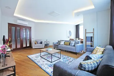 a living room with two couches and a table at Excellent Apartments Fatih Serenity in Istanbul