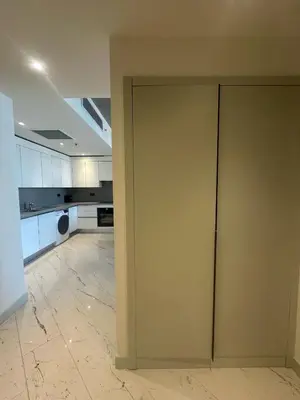 a room with a sliding door in a kitchen at Sinpaş Queen Bomonti Residence by Bondy in Istanbul