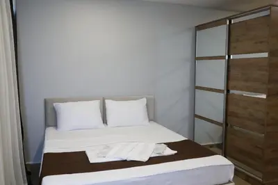 a bedroom with a bed with towels on it at Tavra Daltaban in Istanbul