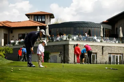 a group of people playing a game of golf at Kemer Country Hotel İstanbul in Istanbul