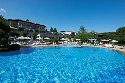 a group of people swimming in a large swimming pool at Kemer Country Hotel İstanbul in Istanbul
