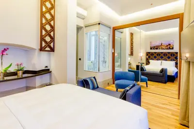a hotel room with a bed and a bedroom at Ravouna 1906 Bosphorus Istanbul in Istanbul