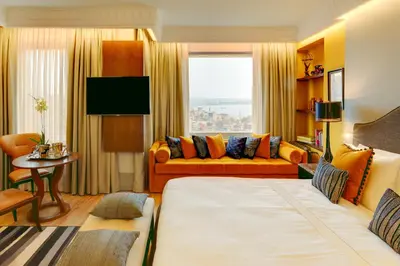 a living room with a large bed and a couch at Ravouna 1906 Bosphorus Istanbul in Istanbul