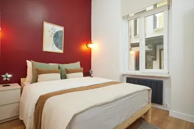 a bedroom with a large bed and a window at Charming 2BR AC in Center - Santur D1 in Istanbul