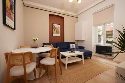 a living room with a blue couch and a table at Charming 3BR 2Bath AC in Center - Santur D2 in Istanbul