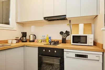 a kitchen with a microwave oven and a stove at Spacious 6BR 3Bath AC in Center - Santur D5-6 in Istanbul
