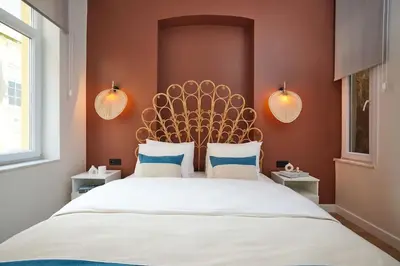 a bedroom with a large bed with a large headboard at Charming 3BR 2Bath AC in Center - Santur D7 in Istanbul