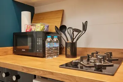 a kitchen counter with a stove and a microwave at Charming 3BR 2Bath AC in Center - Santur D8 in Istanbul