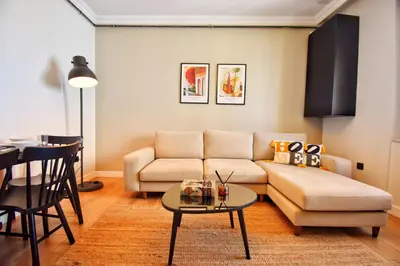 a living room with a couch and a table at Cozy Renovated 3BR near Taksim- Santur D10 in Istanbul