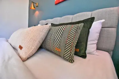 a white couch with two pillows on it at Cozy Renovated 3BR near Taksim- Santur D10 in Istanbul