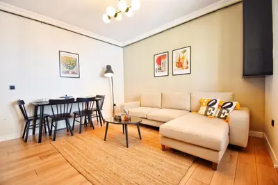 a living room with a couch and a table at Cozy Renovated 3BR near Taksim- Santur D10 in Istanbul