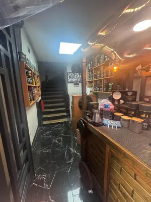 a kitchen with a counter and stairs in a room at The balo pera hotel in Istanbul