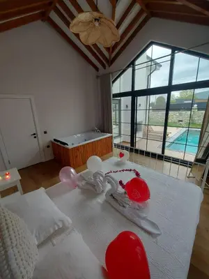 a room with a bed with red and white decorations on it at Sapanca İnci Suit in Yanık
