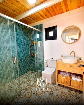 a bathroom with a shower and a sink at THEA Sapanca Bungalov in Dilekli