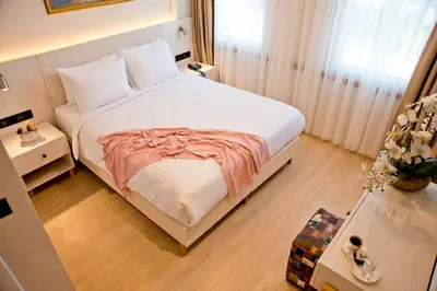 a bedroom with a large white bed in a room at XLoft in Istanbul