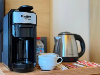 a coffee maker and a cup on a table at Abelia Mansion Hotel in Istanbul