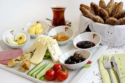 a plate of food with vegetables and other foods at Tolga Hotel in Istanbul