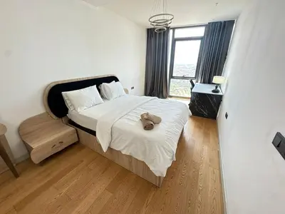 a bedroom with a bed with a stuffed animal on it at Luxury apt in the 40 plus floor in Istanbul