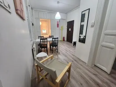 a dining room with a table and chairs in a room at Nostalgia Apartment in Istanbul