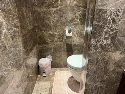 a bathroom with a toilet and a glass shower at ultra lüxs in Istanbul