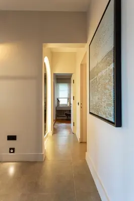 a hallway with a large painting on the wall at Bosphorus Designer Suite Seperate Guest room in Istanbul
