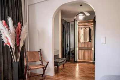 a hallway with a dressing room with a chair and a mirror at Bosphorus Designer Suite Seperate Guest room in Istanbul