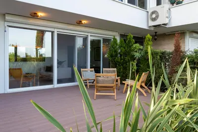 a patio with chairs and a table in front of a house at Bosphorus Designer Suite Seperate Guest room in Istanbul