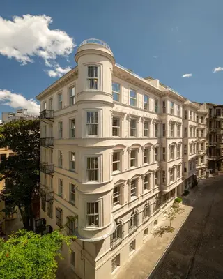 a large white building on a city street at Casa Foscolo Hotel, Istanbul, a Member of Design Hotels in Istanbul
