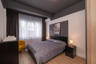 a bedroom with a bed and a window at Hip Waterfront Apt with a Striking View in Istanbul