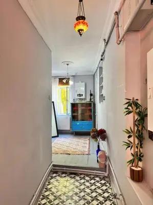 a hallway with a tile floor in a house at Yildirim's Home in Istanbul