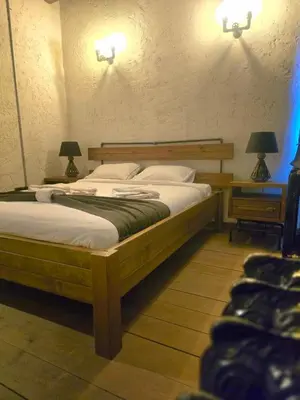 a bedroom with two beds and two lamps at Balat luxury House With Sea View in Istanbul