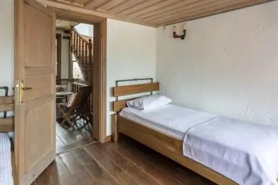 a small bedroom with a bed and a staircase at Balat luxury House With Sea View in Istanbul