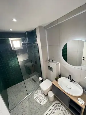 a bathroom with a shower and a toilet and a sink at Golden Arrow Taksim 1 in Istanbul