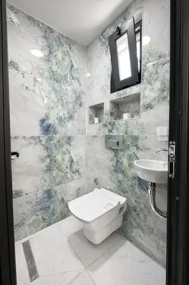 a bathroom with a toilet and a sink at Kilic Boutique Hotel in Istanbul