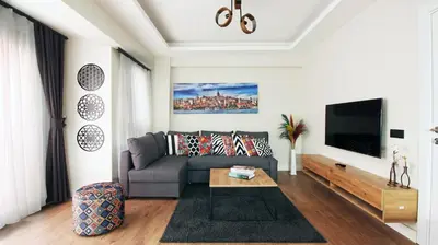 a living room with a couch and a tv at Excellent Apartments Fatih Legacy in Istanbul