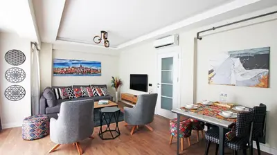 a living room with a table and a couch at Excellent Apartments Fatih Legacy in Istanbul