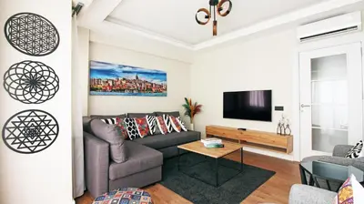 a living room with a couch and a tv at Excellent Apartments Fatih Legacy in Istanbul
