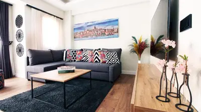 a living room with a couch and a coffee table at Excellent Apartments Fatih Legacy in Istanbul