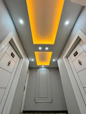 a room with a ceiling with a yellow light at Cevas Suite Hotel in Istanbul