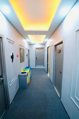 a hallway in an office building with a hallway at Cevas Suite Hotel in Istanbul